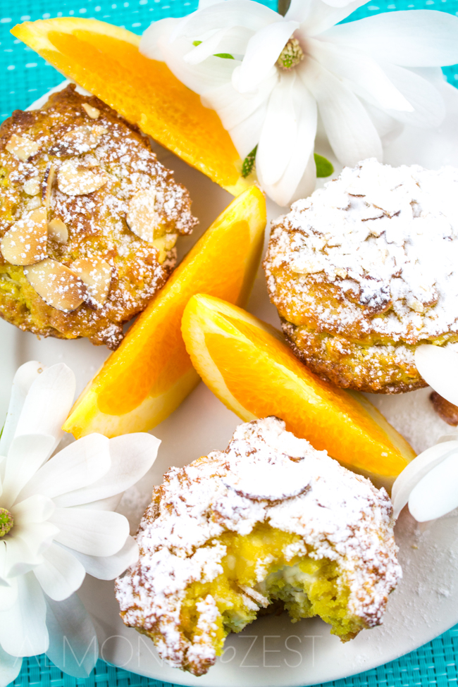 Orange and Cream Cheese Muffins - One of the BEST muffin recipes ever! Super soft, moist, zesty flavor with a glorious cream cheese center. Sooo YUM!!